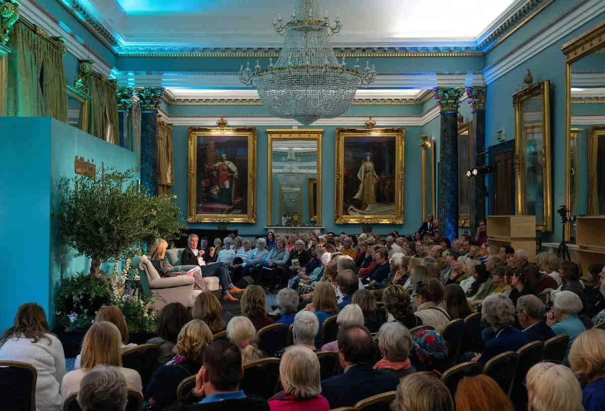 Audience gathered in a grand room for a brand event