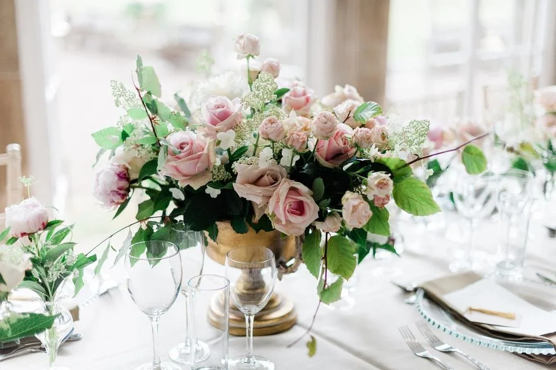 Soft pink rose centrepiece on a wedding table