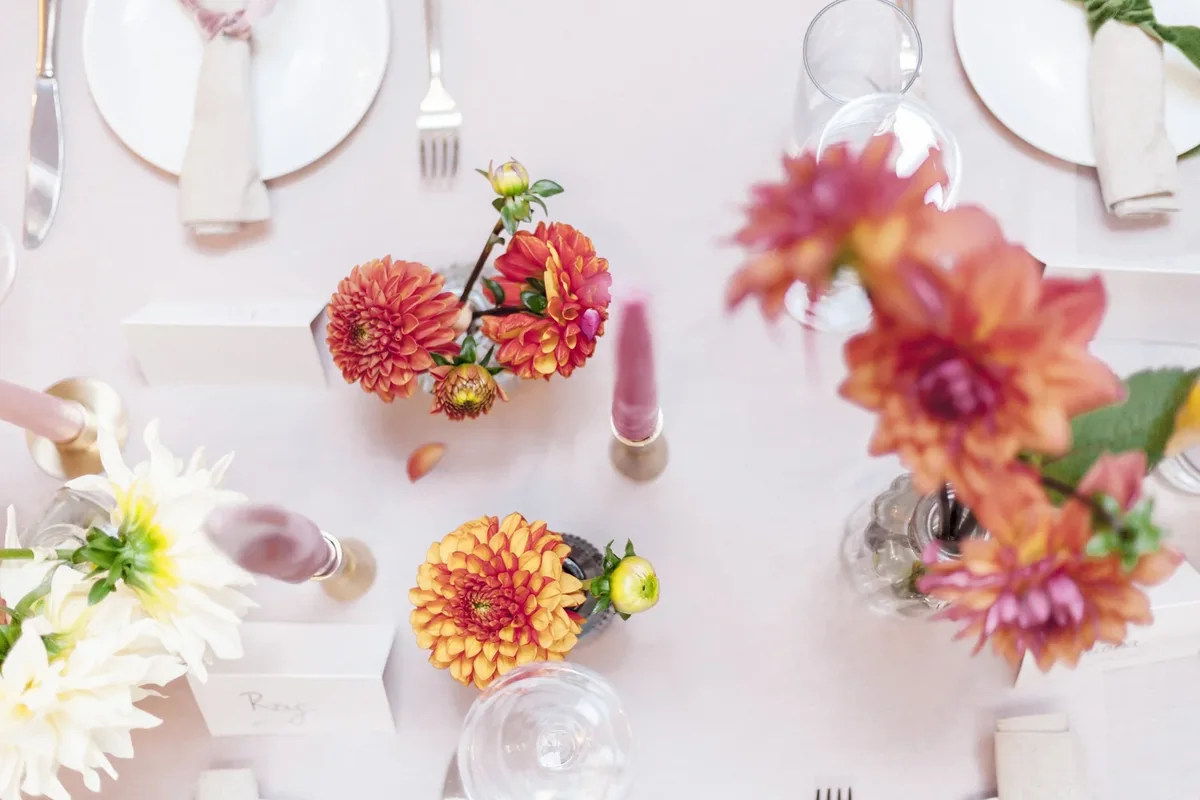 Overhead view of small colourful event arrangements