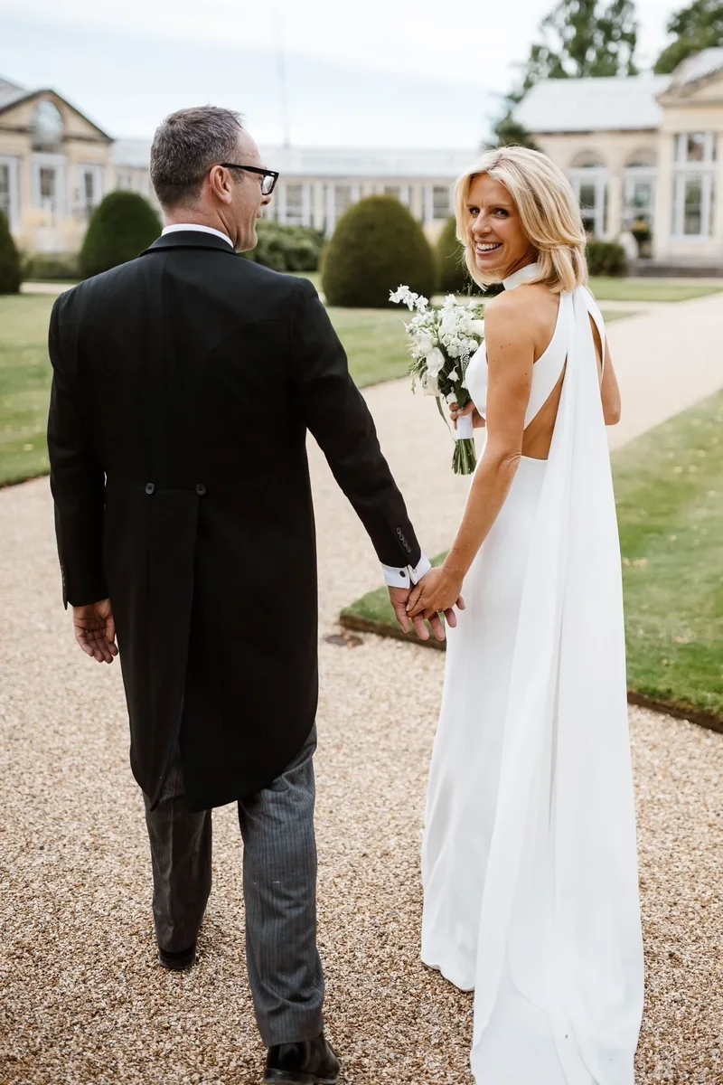 Bride and groom walking through the grounds of their wedding venue