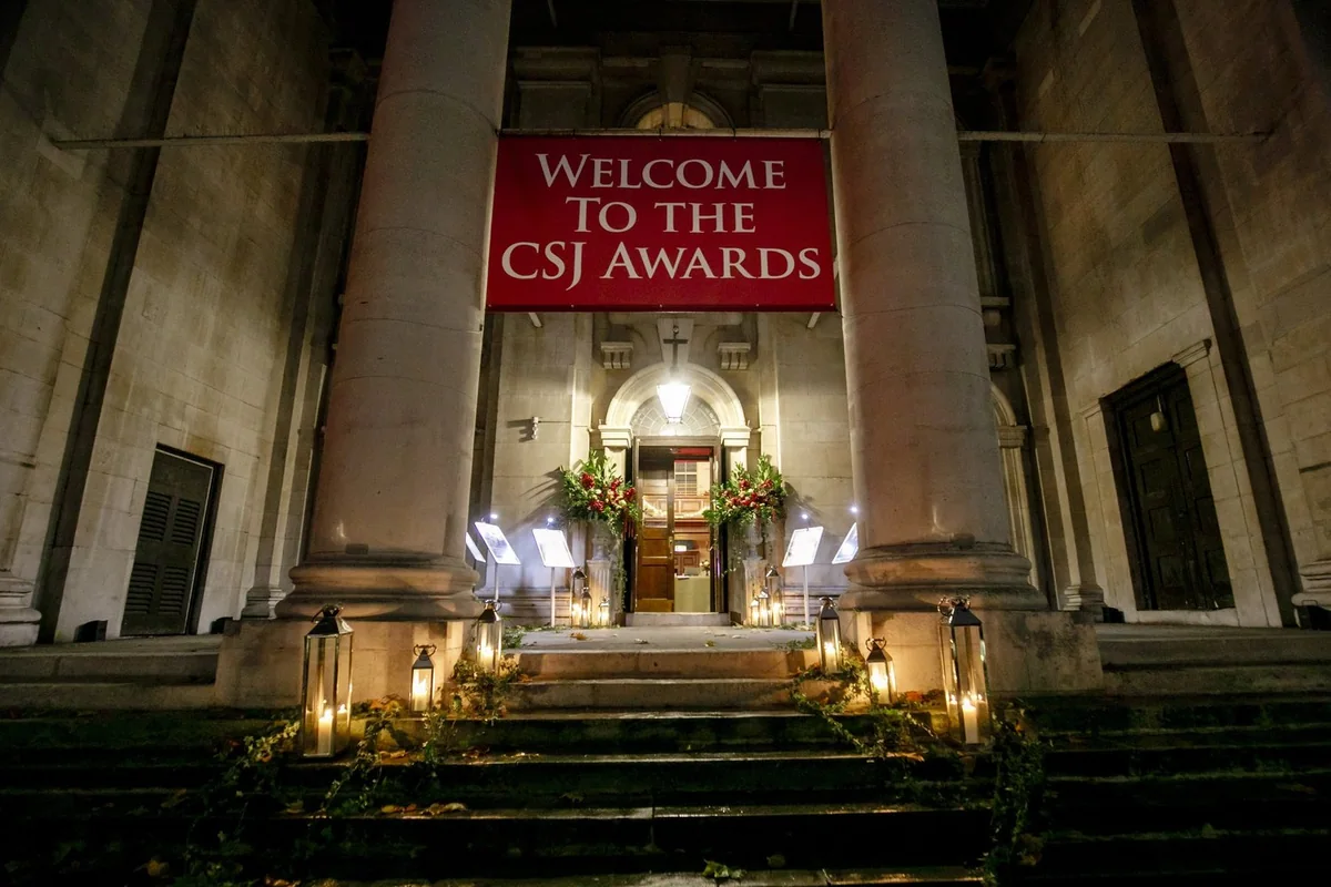 Awards venue entrance illuminated at night