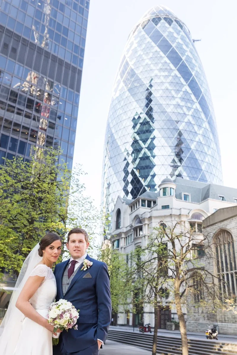 Newlyweds photographed beside the Gherkin in London
