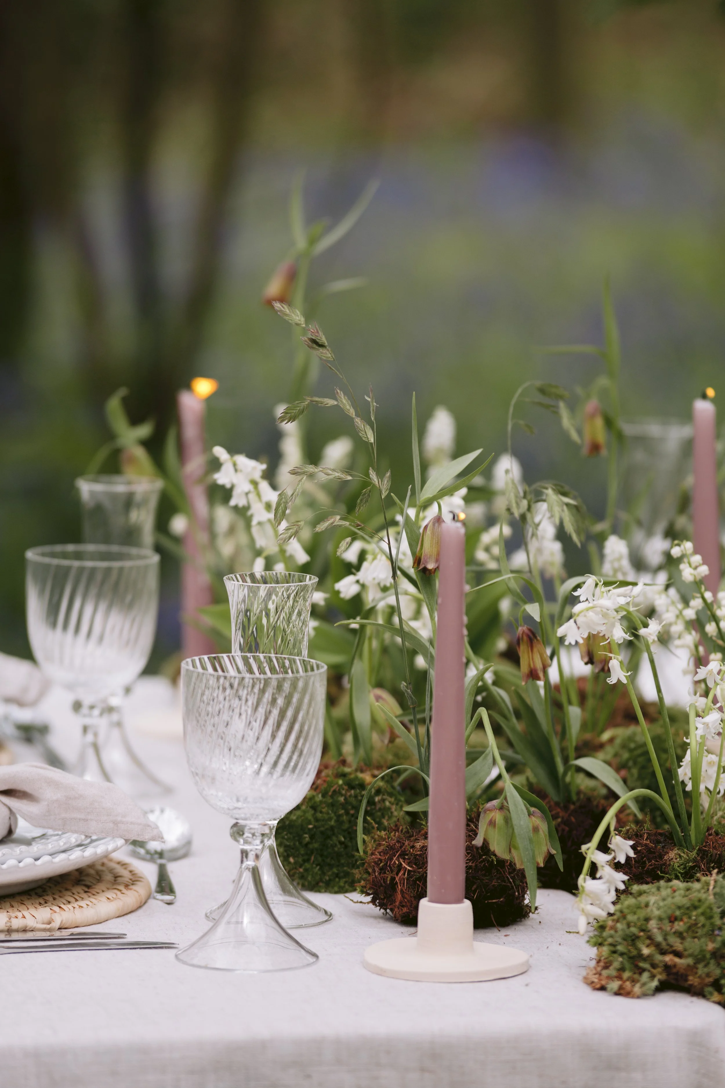 Seasonal wedding tablescape surrounded by woodland