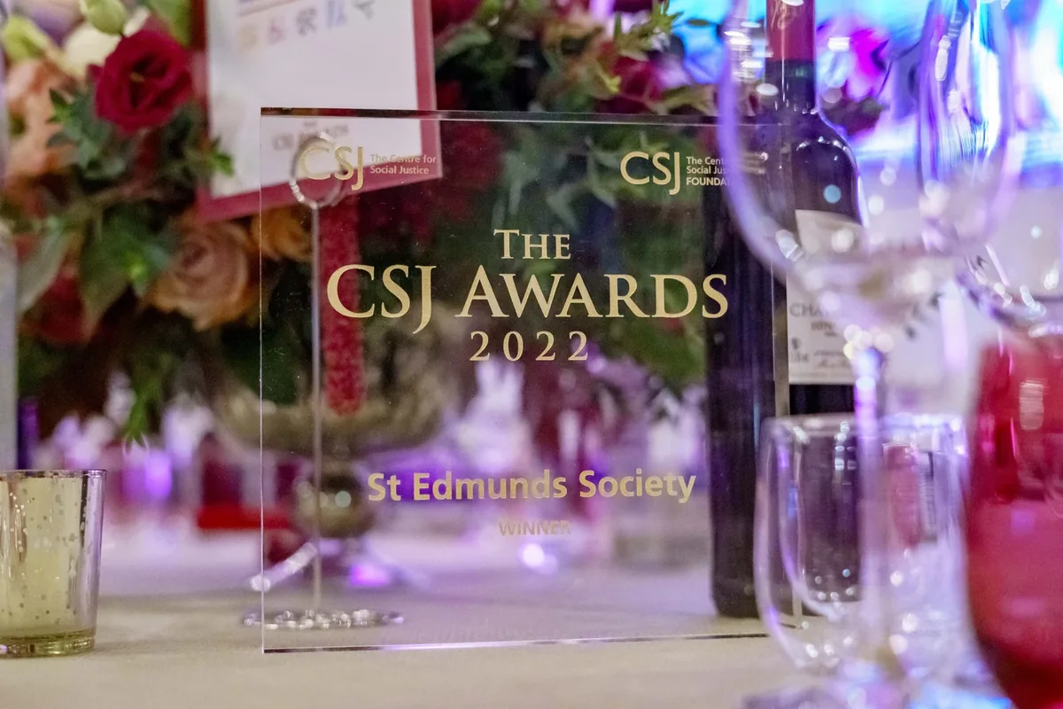 Awards branding reflected through a floral table arrangement